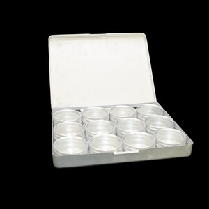 May include: A white plastic storage box with a hinged lid, containing 16 clear plastic containers.