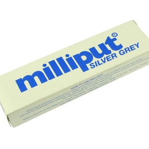 May include: A tube of Milliput Silver Grey epoxy putty. The tube is white with blue lettering and a registered trademark symbol.