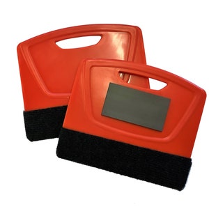 May include: Two red plastic squeegees with black felt edges. The top squeegee has a handle with a cutout. The bottom squeegee has a black felt edge and a rectangular magnet.