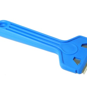 May include: A blue plastic scraper with a metal blade. The scraper has a comfortable grip and is designed for removing ice, frost, or other debris.
