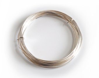 May include: A coil of silver wire, perfect for jewelry making or crafting projects.