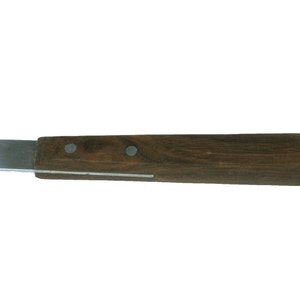 May include: A small, wooden-handled utility knife with a silver blade. The handle is dark brown with two silver rivets.