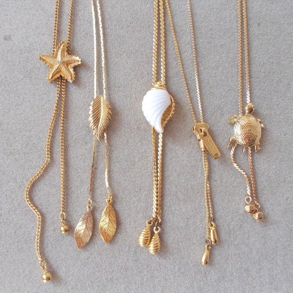 Choice - Avon LARIAT NECKLACE Slide Bolo Goldtone Zipper Starfish Turtle Leaves White Seashell Chain (cr)