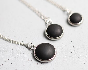 Short stainless steel necklace with matt - black gemstone