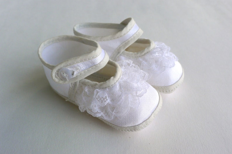 white satin baby shoes