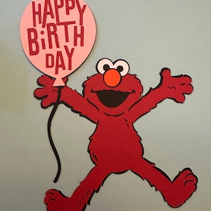 May include: Red Elmo character holding a pink balloon with the text "HAPPY BIRTHDAY" in red letters.