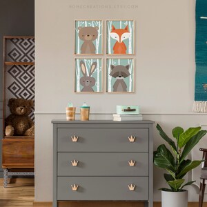 Woodland nursery wall art set of 4 teal birch prints styled as gallery wall in baby nursery