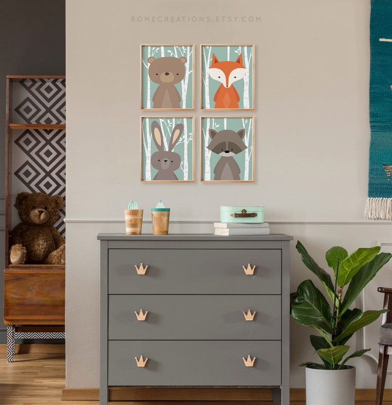Woodland nursery wall art set of 4 teal birch prints styled as gallery wall in baby nursery