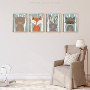 Woodland nursery wall decor set of 4 rustic forest prints displayed in baby boy room