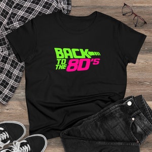 May include: Black t-shirt with a green and pink graphic that says "Back to the 80's".