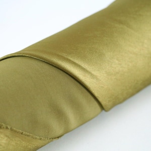 May include: A set of three ceramic mugs with a speckled, cream-colored glaze. Each mug features a different hand-painted floral design in shades of blue, green, and yellow. The mugs have a simple, rounded shape and a comfortable handle.