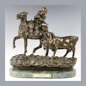 May include: Bronze sculpture depicting a man on horseback chasing a cow. The sculpture is titled "Ukrainian Rustler" by Grechos and is displayed on a green marble base.