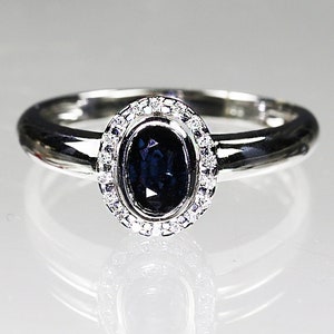 Fine 14K solid white gold Ring with blue sapphire and diamonds size 6 sizeable