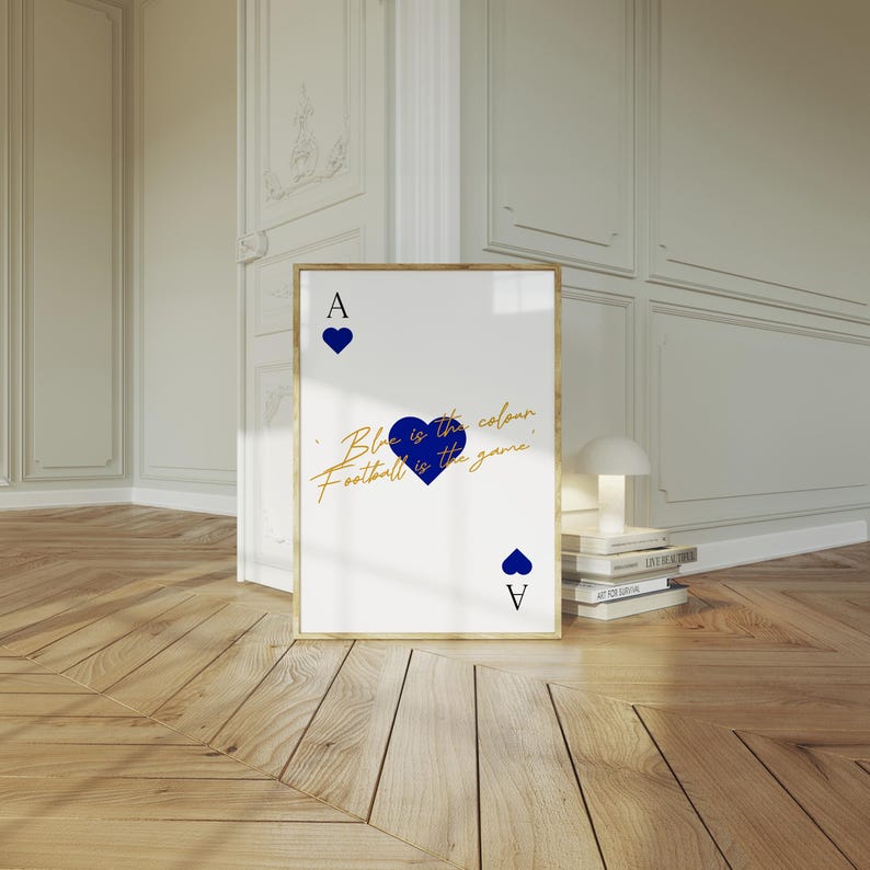 May include: Framed art print featuring a playing card design. The white card has a gold border and displays the Ace of Hearts with blue heart symbols. Text in gold script reads "Blue is the colour, Football is the game."