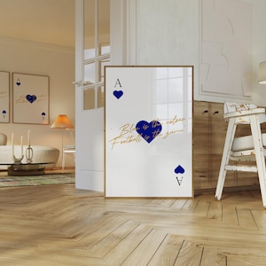 May include: A framed art print featuring a playing card design with a blue heart suit. The text "Blue is the colour, Football is the game" is written in gold script. The Ace of Hearts is displayed.
