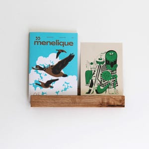 Zwevende houten plank. Zwevende plank. Platenplank. Boekenplank. Boekenplank aan de muur.