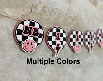 Layered 1st Birthday Milestone Banner: Checkered Flag, Pink, Blue, Yellow, Purple, Green, Beige, #firstbirthday