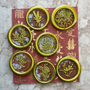 7 floral wax seals, red and white with gold embellishments