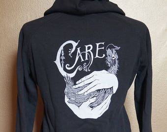 Youth L "Care" Hoodie, White Ink on Black