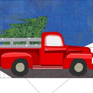May include: A red pick-up truck with a Christmas tree in the back. The truck is driving on a grey road with a blue sky in the background.