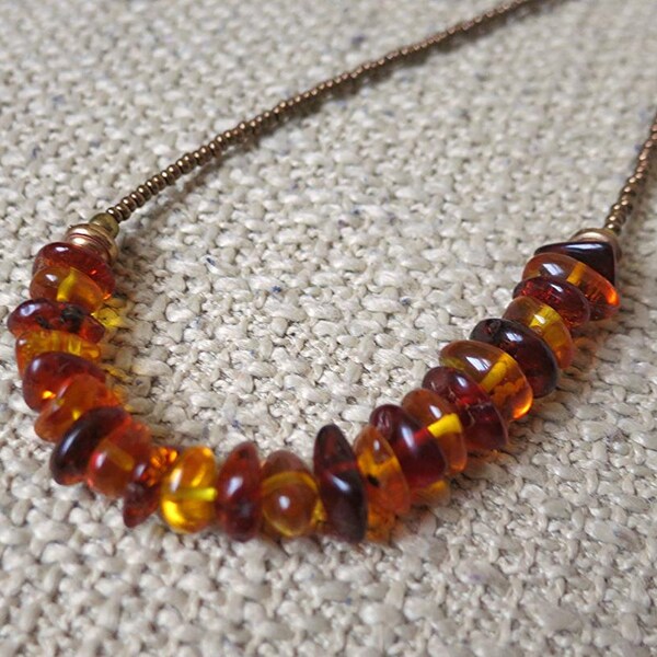Genuine Baltic Amber long necklace. Simple and dainty Modern style, perfect for layering. Gold, Orange, Brown & Amber hues. Genuine Fossil