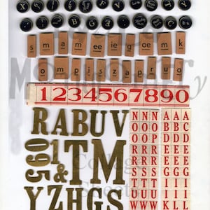 May include: Assortment of vintage typewriter keys, letter tiles, and gold foil letters and numbers. The keys are black with gold lettering and the tiles are brown with black lettering. The gold foil letters and numbers are on a white background.