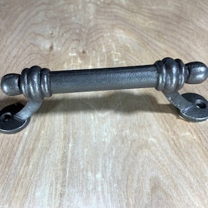 May include: A handmade wooden sign with the text "Welcome" in a playful font. The sign features a distressed finish and a natural wood grain background, perfect for a front door or entryway. Measures approximately 12 inches wide.