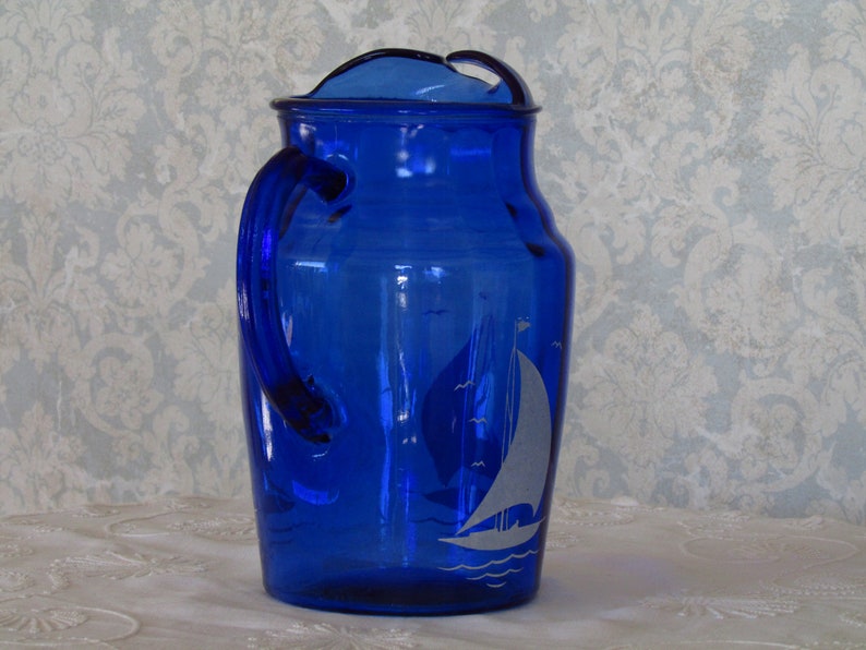 cobalt blue depression glass with sailboat