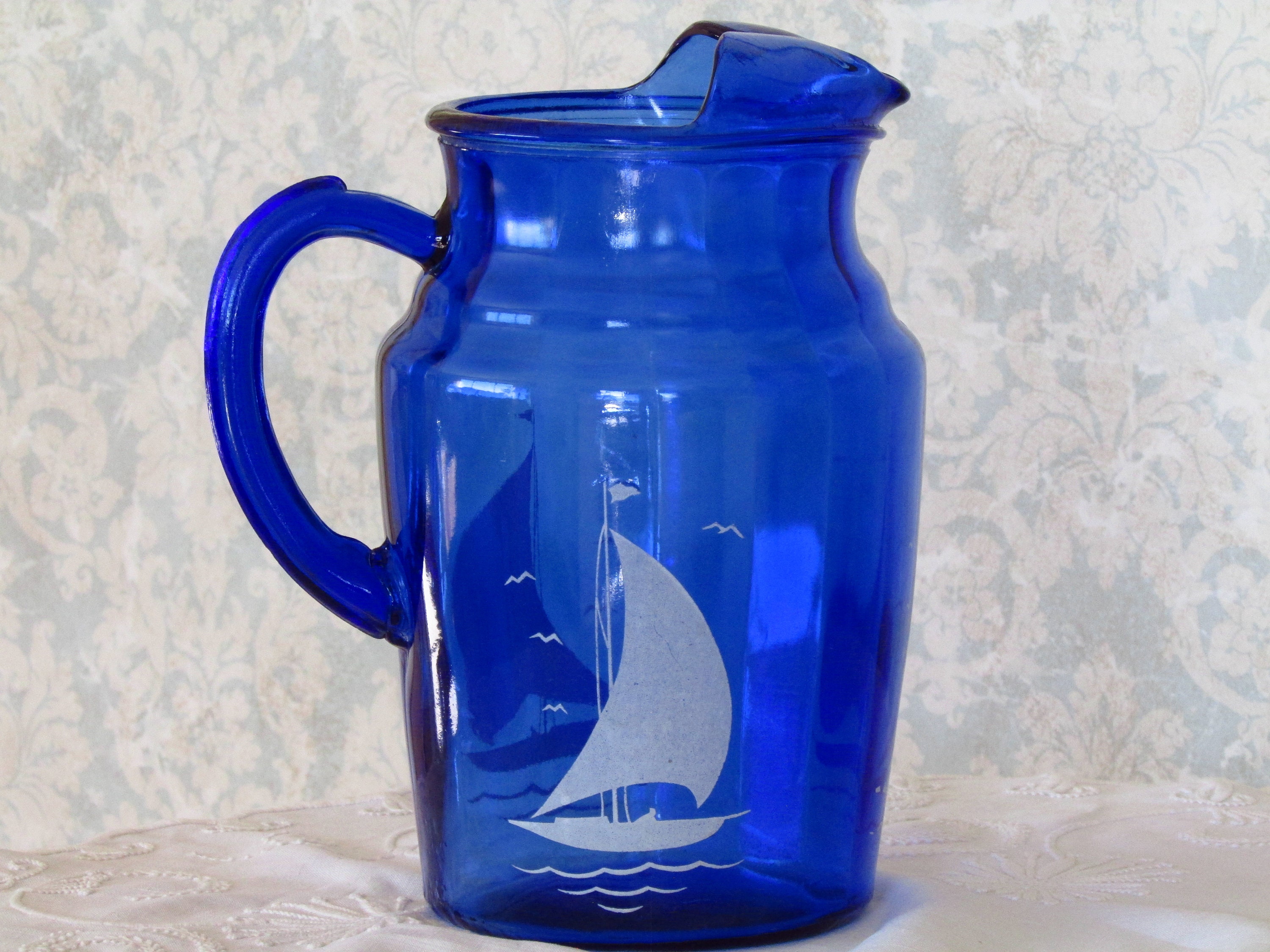 cobalt blue depression glass with sailboat