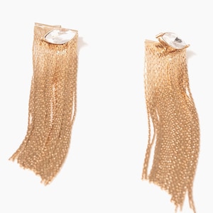 gold chain fringe statement earrings with crystal stud marquis on white background