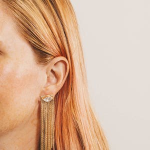 gold fringe earring jackets with crystal stud earrings on strawberry blonde model