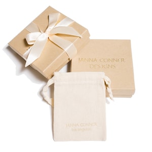 janna Conner branded jewelry pouch and box with ribbon