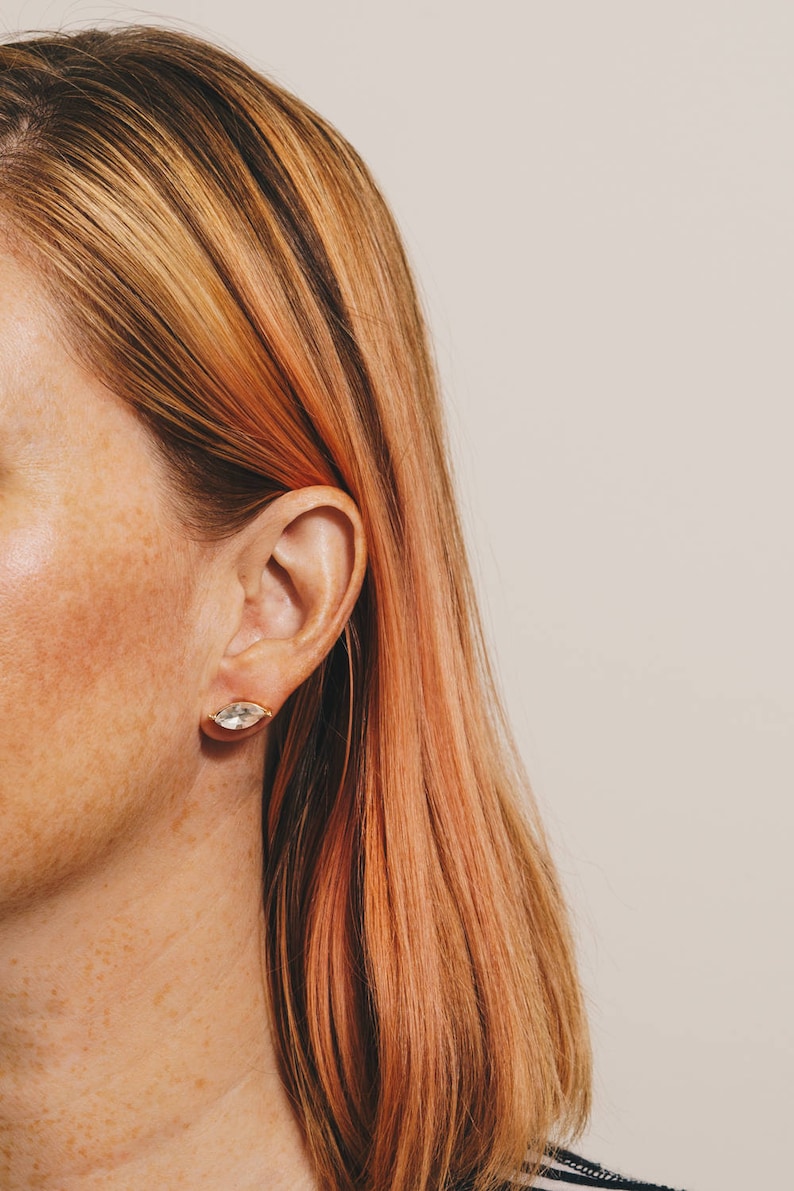 crystal marquis stud earrings on pink shoulder length haired model with freckles