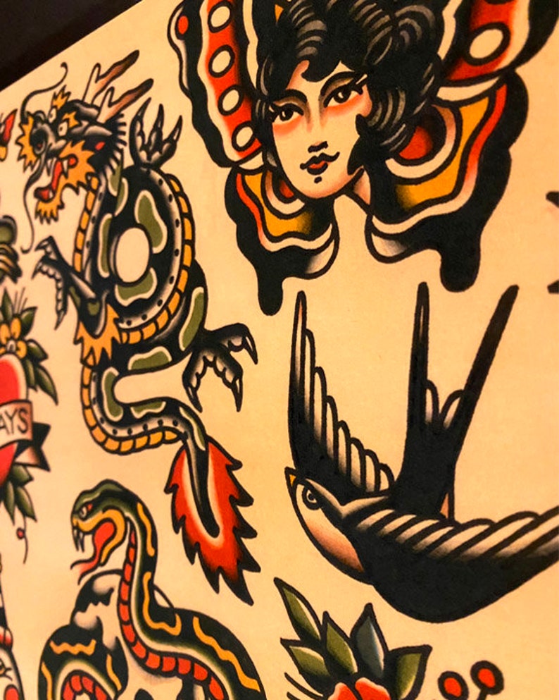 May include: A traditional tattoo flash sheet with a variety of colorful designs, including a green dragon, a black and white swallow, a red heart with flowers, a snake, and a woman with butterfly wings.