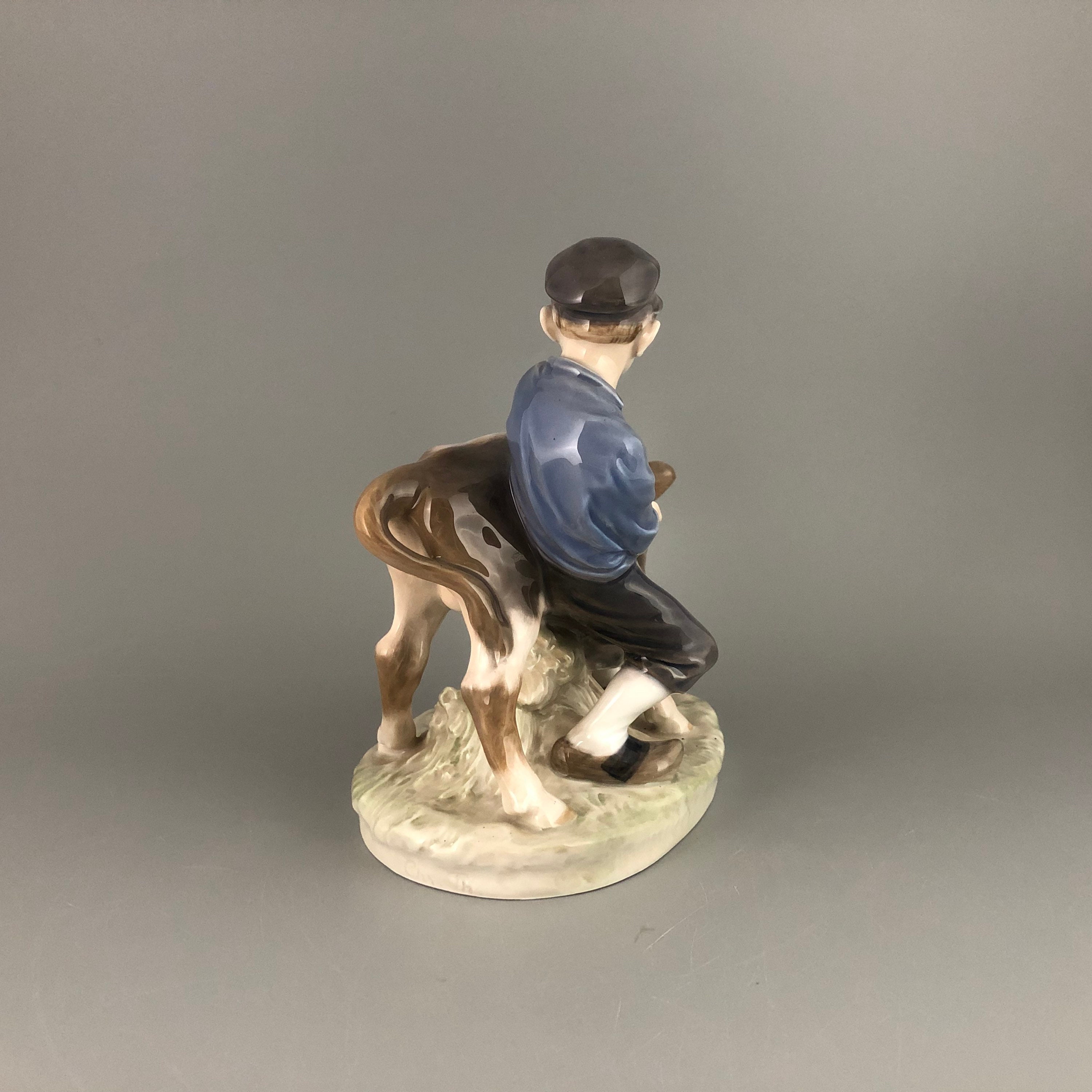 Royal Copenhagen Denmark Boy holding Cow #772 by Christian Thomsen
