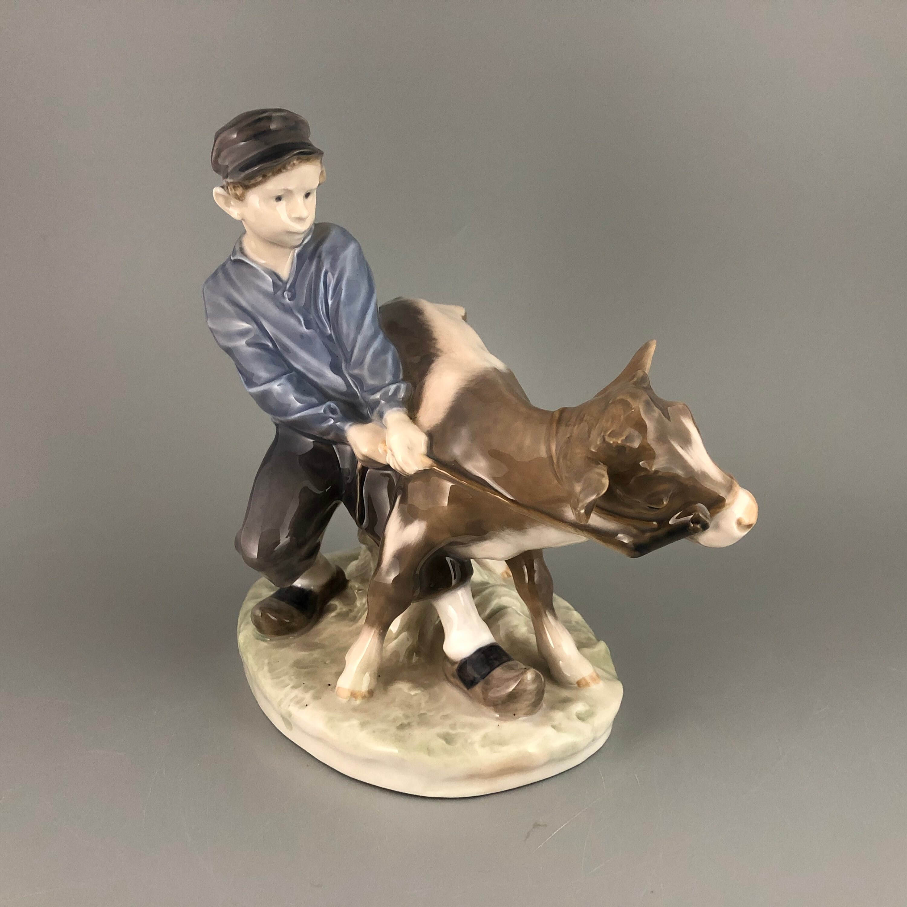 Royal Copenhagen Denmark Boy holding Cow #772 by Christian Thomsen