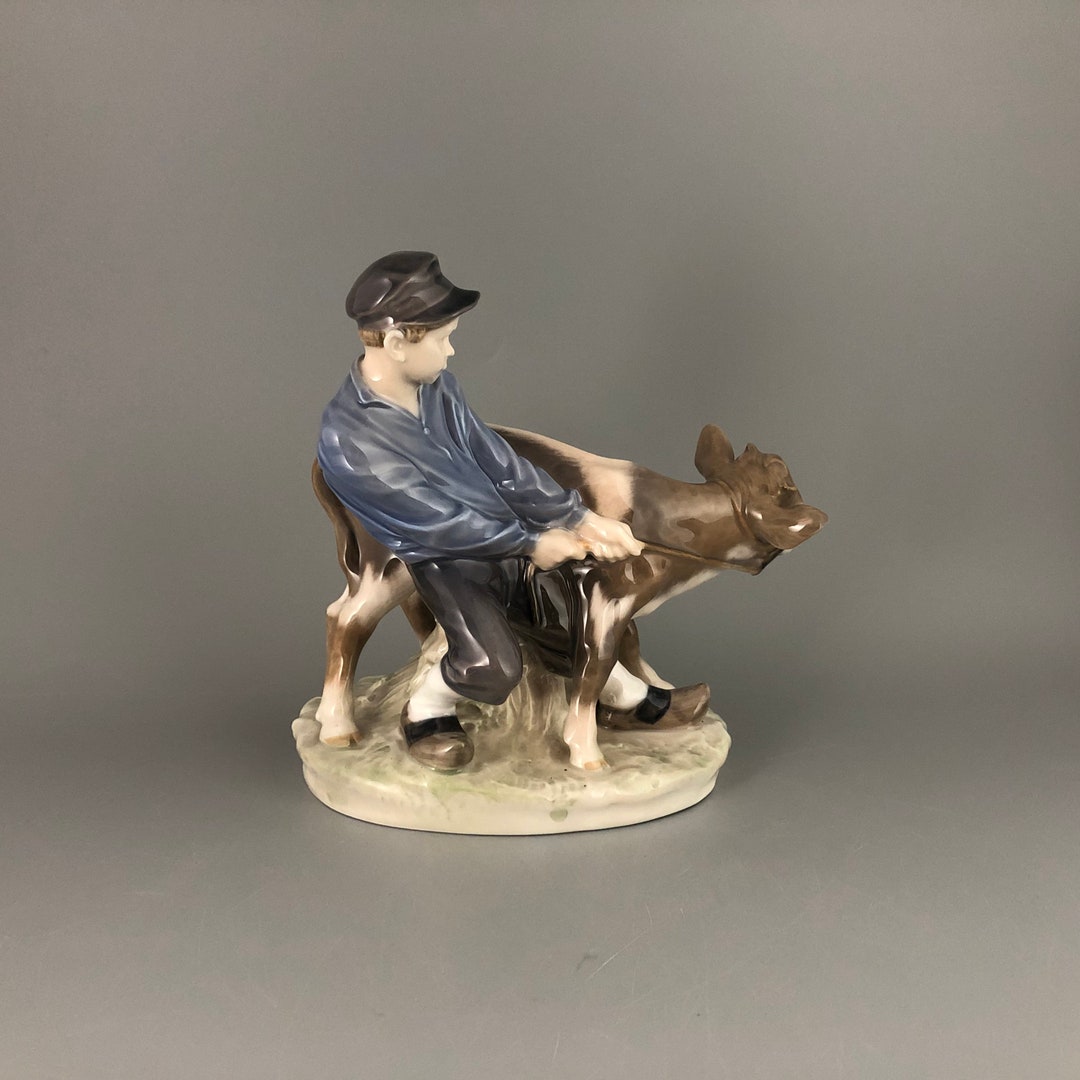 Royal Copenhagen Denmark Boy holding Cow #772 by Christian Thomsen Royal Copenhagen Denmark Boy holding Cow #772 by Christian Thomsen