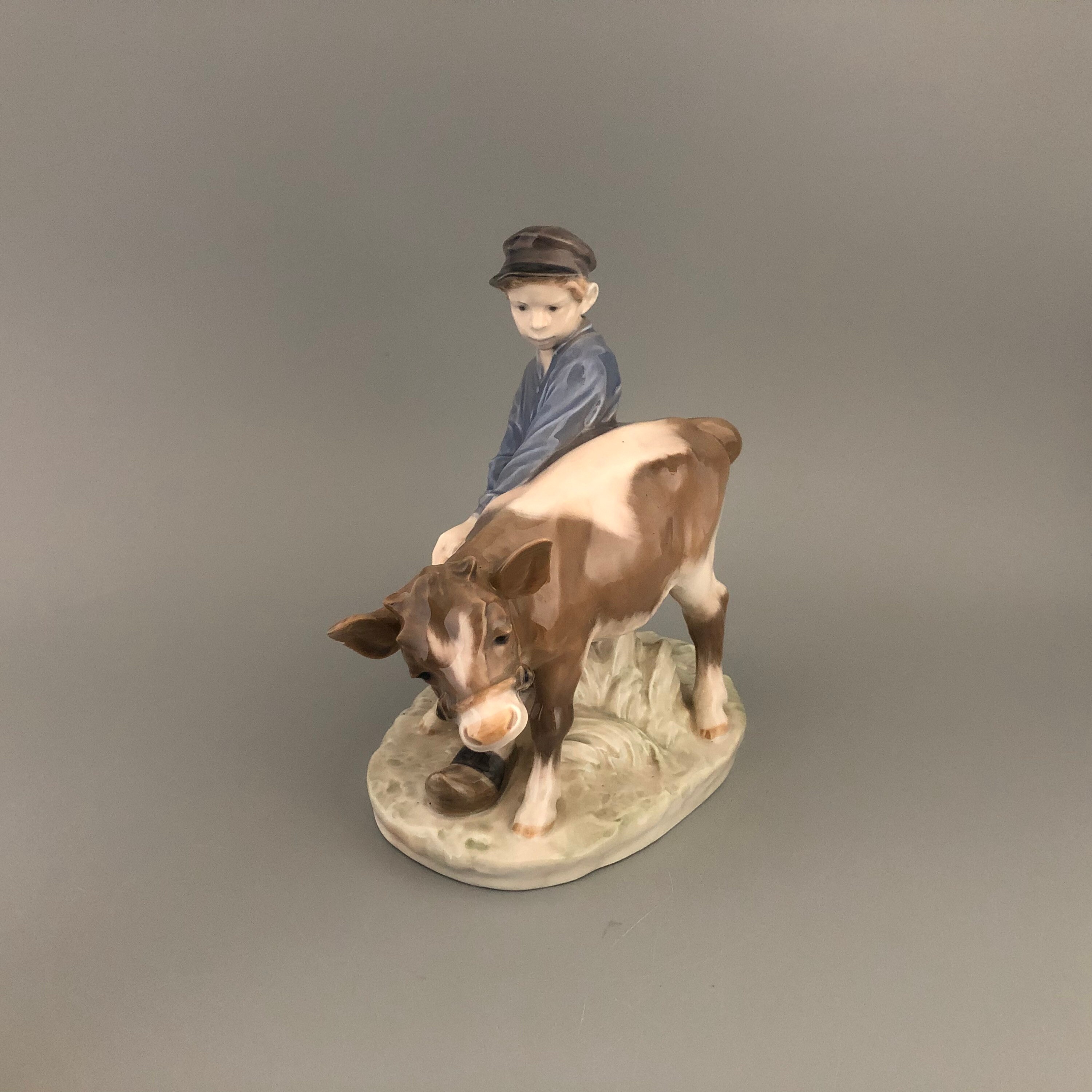 Royal Copenhagen Denmark Boy holding Cow #772 by Christian Thomsen