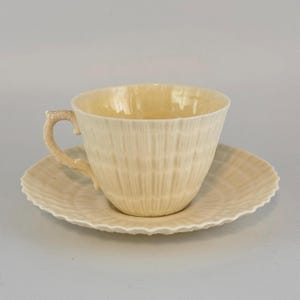 Belleek Teacup from Ireland - Clam and Coral Limpet Design - Yellow Luster Accent Bel-eek