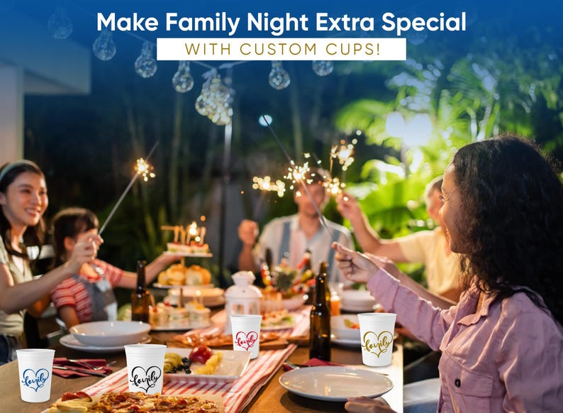 May include: A family gathering with custom cups. The white cups have heart-shaped designs with the word "lovely" in various colors. The scene includes food, drinks, and sparklers, with the text "Make Family Night Extra Special with Custom Cups!"