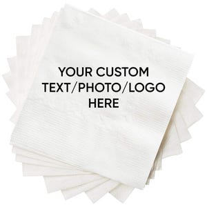May include: A stack of white paper napkins with the text "YOUR CUSTOM TEXT/PHOTO/LOGO HERE" printed on the top napkin.