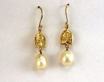 Hanging Pearl earrings with a raised symmetrical wire design in solid 9k gold.