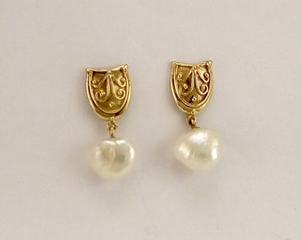 U-shaped earring studs with a raised symmetrical wire design in solid 9k gold, and hanging Fresh Water Pearls.