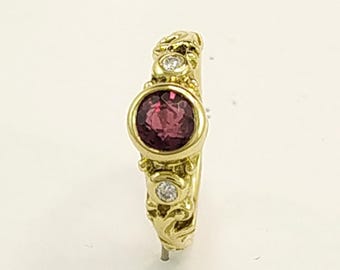Facetted cut Natural Burmese Ruby Dress Ring in a solid 18 K gold hand carved flowing design set with 2 brilliant cut diamonds.
