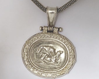 Pendant, with Ancient Greek intaglio seal impression of a Lion attacking a Bull in sterling silver.