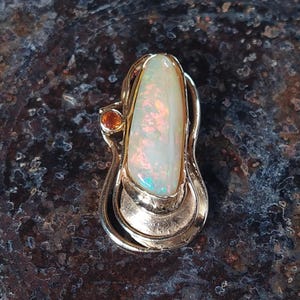 Australian Opal Pendant in solid 18 carat gold set with a brilliant cut orange diamond highlight