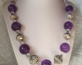 Necklace of Antique Carved Amethyst and Silver Beads, with rock crystal briolette and fluorite beads.