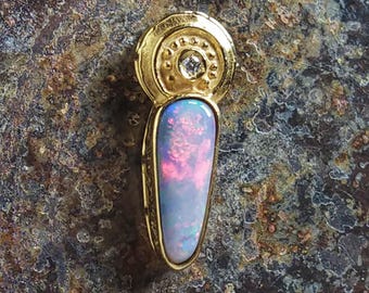 Australian Black Fire Opal Pendant in solid 18 carat gold set with a brilliant diamond highlight
