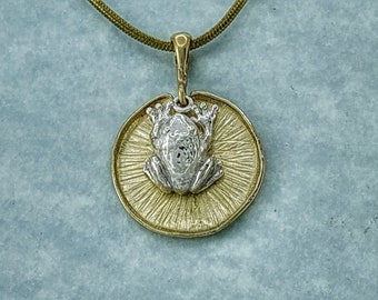 Frog Pendant in Solid 925 Sterling Silver sitting on a 9k gold Lily Pad lotus leaf