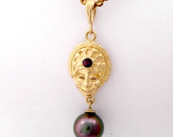 Ceremonial Head Dress Pendant set with Amethyst and hanging Tahitian Black Pearl in 9 k Gold